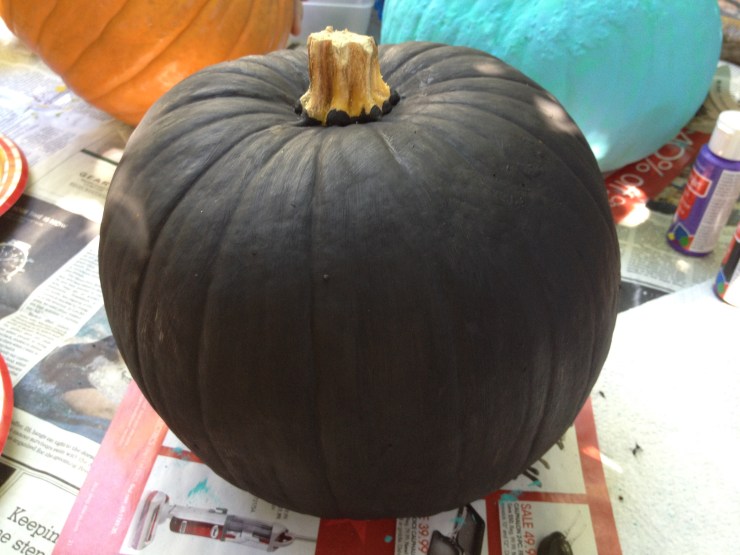 Step 1: Paint the entire pumpkin black and the stem gold.